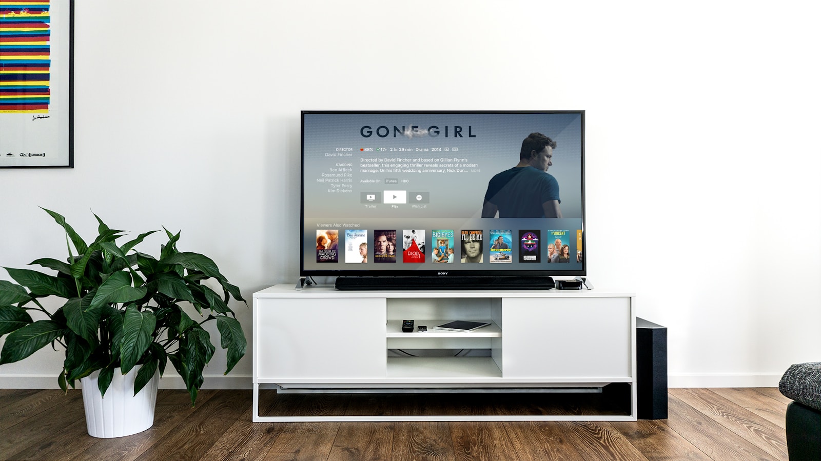 Flat-screen television set up in a bright living room